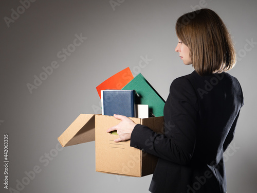Unemployed woman with box o...