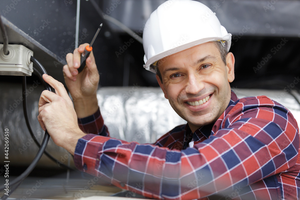 male engineer fixing solar pannels cables male engineer fixing solar pannels cables