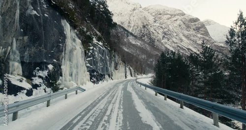 POV Of A Driver Driving On Tunnel Road Revealing Snowy Mountain Near Eresfjord In Norway. photo