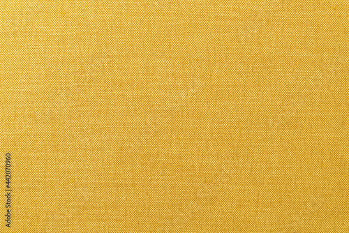 Photo yellow or golden mustard fabric texture for background