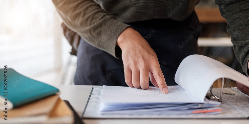 Businessman analysis meny financial documents, tax, accounting, statistics and analytic research concept Businessman analysis meny financial documents, tax, accounting, statistics and analytic research concept