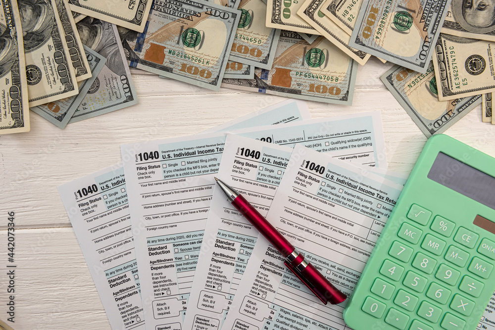Obraz premium 1040 individual form, with us money. Tax time concept