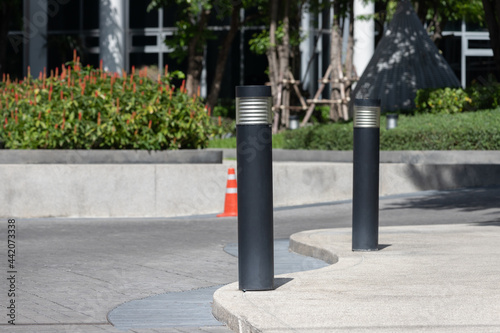фотографія black light steel bollards on footpath.