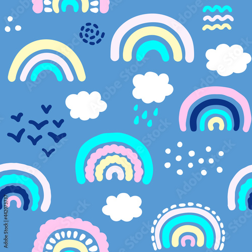 Seamless pattern with hand drawn rainbows and clouds. Cartoon Vector Illustration. Kids texture for fabric, wrapping, textile, wallpaper. 