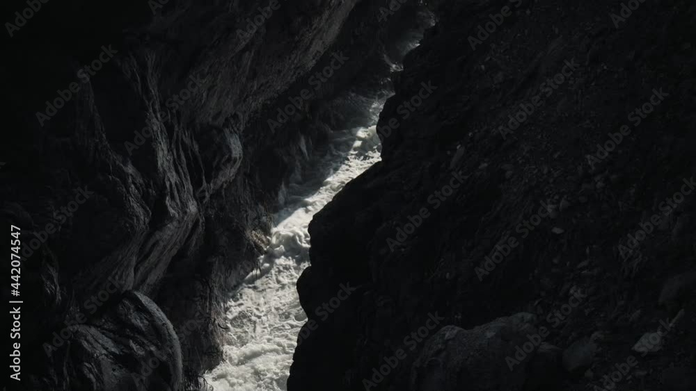 Slow motion water crushing on a cave. Slow motion water crushing on a cave.