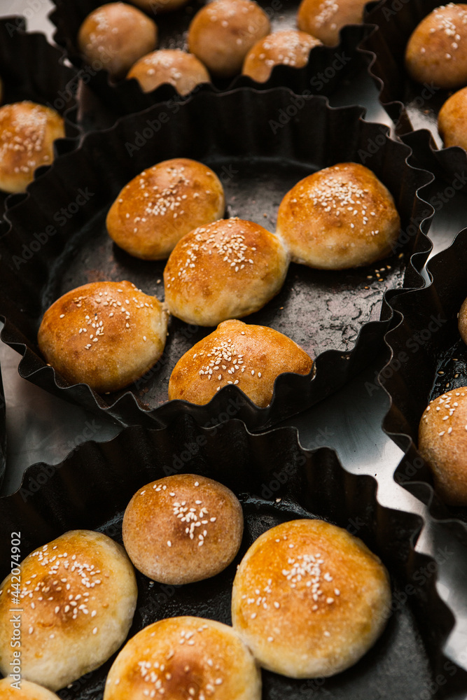 Fresh homemade bread taken from the wood oven. Close up of rustic whole meal bread rolls Fresh homemade bread taken from the wood oven. Close up of rustic whole meal bread rolls