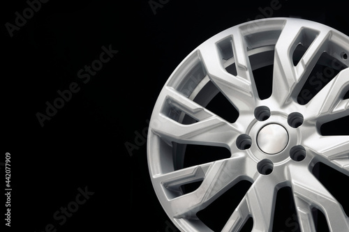 car silver alloy wheel, an unusual design of wheel spokes. techno design