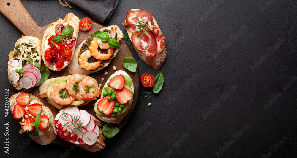 Appetizers board with traditional spanish tapas set. Italian antipasti brushetta snacks