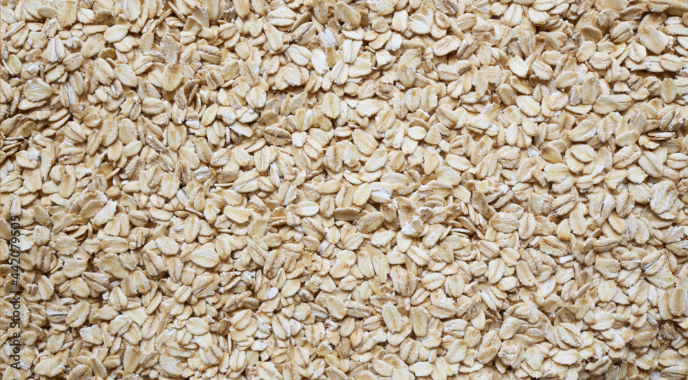 Oatmeal close-up background. Texture of grain superfoods good for health and beauty Oatmeal close-up background. Texture of grain superfoods good for health and beauty