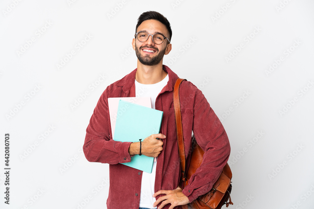 Young student man isolated on white background posing with arms at hip and smiling Young student man isolated on white background posing with arms at hip and smiling