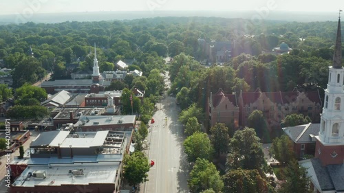 Establishing shot of Chapel Hill town, East Franklin Street. UNC, University of North Carolina buildings and University United Methodist and Presbyterian churches, steeples. photo