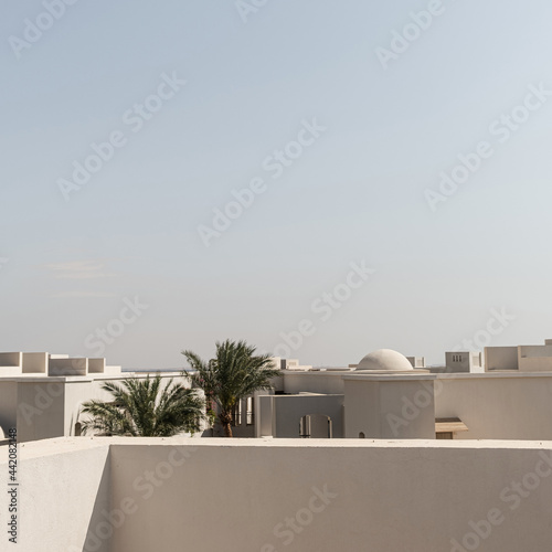 Modern oriental building with beige walls with picturesque view photo