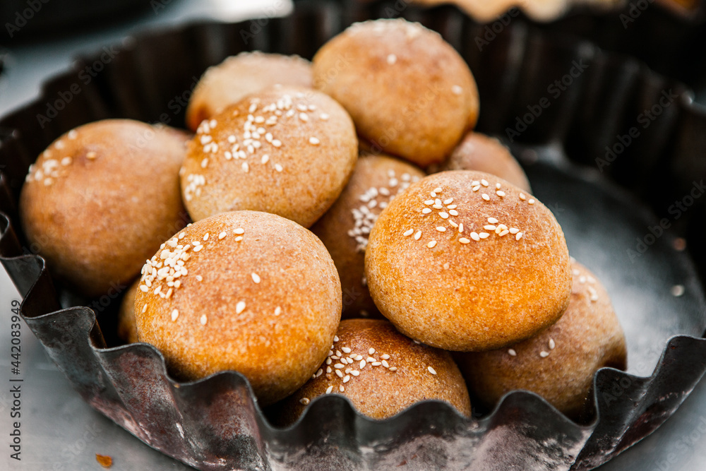 Fresh homemade bread taken from the wood oven. Close up of rustic whole meal bread rolls Fresh homemade bread taken from the wood oven. Close up of rustic whole meal bread rolls