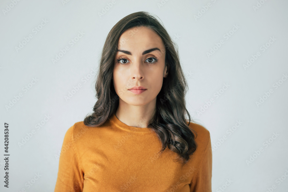 © My Ocean studio - Beautiful modern confident brunette woman portrait with curly hair while she is looking on the camera. © My Ocean studio - Beautiful modern confident brunette woman portrait with curly hair while she is looking on the camera.