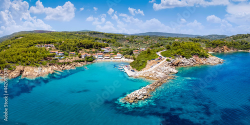 Fototapeta Naklejka Na Ścianę i Meble -  Panoramic aerial view to the coast and little fishing village of Katigiorgis, South Pelion, Greece, with turquoise sea 