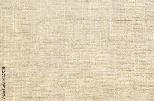 Linen fabric texture background. Simple and basic pattern textile. Natural champagne beige cloth surface closeup