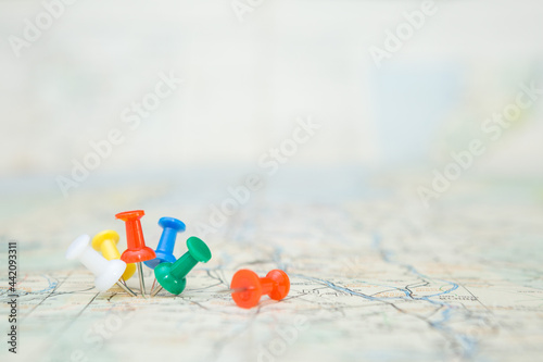 Selective focus of Colorful Many pins  on map background