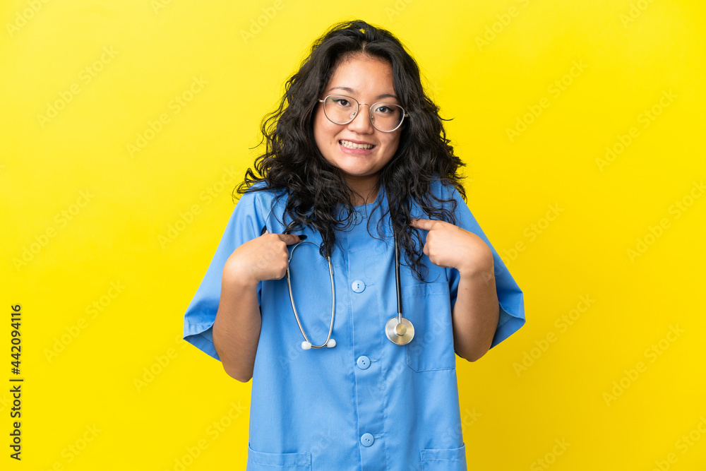 Young surgeon doctor asian woman isolated on yellow background with surprise facial expression Young surgeon doctor asian woman isolated on yellow background with surprise facial expression