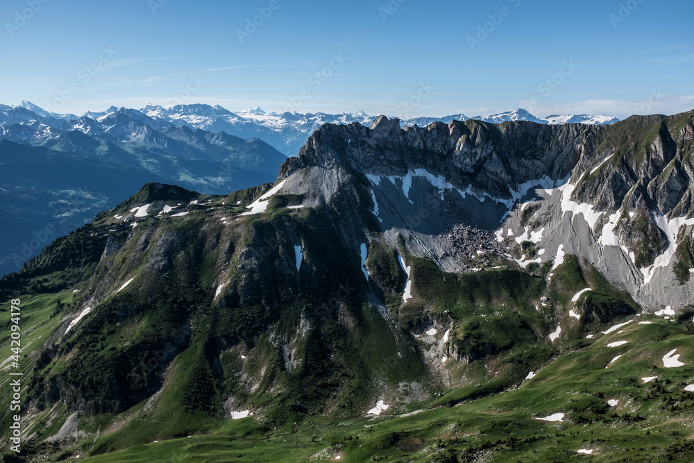 Landscape view of the swiss Alps, with blue sky in the background, shot from the 