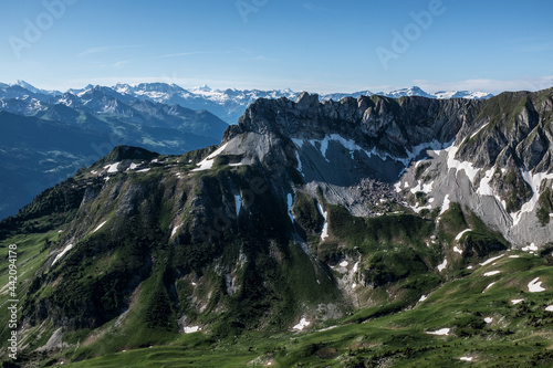 Landscape view of the swiss Alps, with blue sky in the background, shot from the 