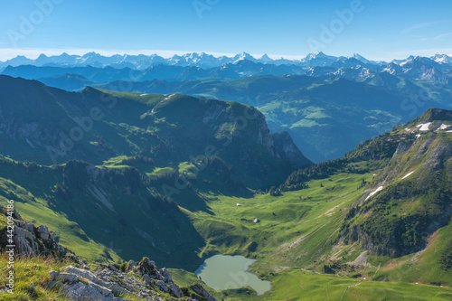 Landscape view of the swiss Alps, with blue sky in the background, shot from the "Kaiseregg" mountain, near Schwarzsee,Fribourg, Switzerland