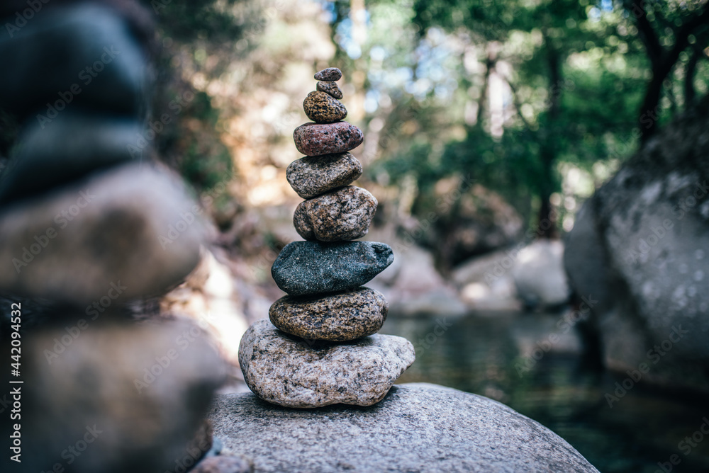 Pyramid of stones in front of a river Pyramid of stones in front of a river