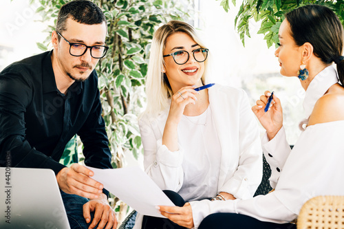 Young business colleagues working togheder  at the office photo