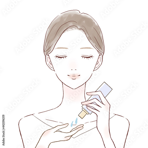 スキンケア用オイルを手に取る女性
