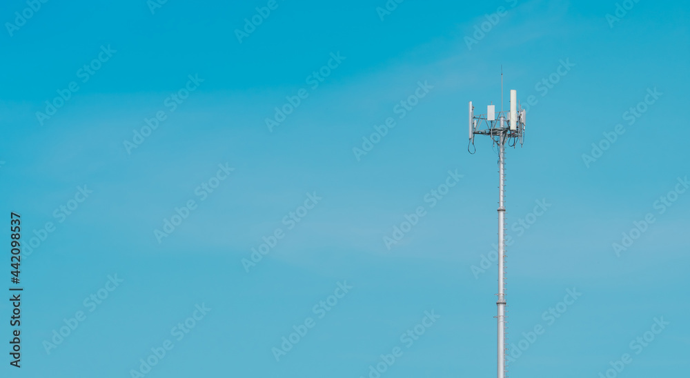 Telecommunication tower with clear blue sky background. The antenna on blue sky. Radio and satellite pole. Communication technology. Telecommunication industry. Mobile or telecom 4g network. Telecommunication tower with clear blue sky background. The antenna on blue sky. Radio and satellite pole. Communication technology. Telecommunication industry. Mobile or telecom 4g network.