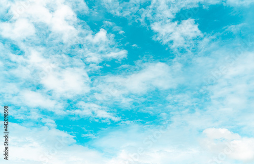 Fototapeta Naklejka Na Ścianę i Meble -  White fluffy clouds on blue sky. Soft touch feeling like cotton. White puffy cloudscape. Beauty in nature. Close-up white altocumulus clouds texture background. Sky on a sunny day. Pure white clouds.