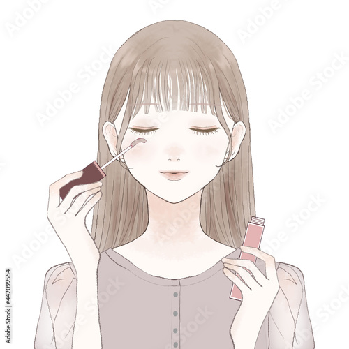 まつ毛美容液をまつ毛に塗ってまつ育する女性