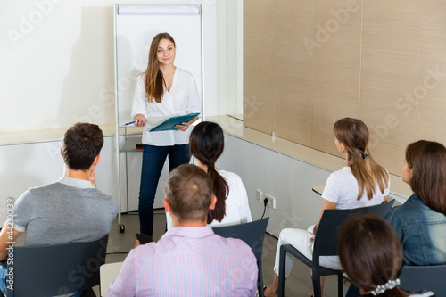 Businesswoman presenting strategy to colleagues in modern office