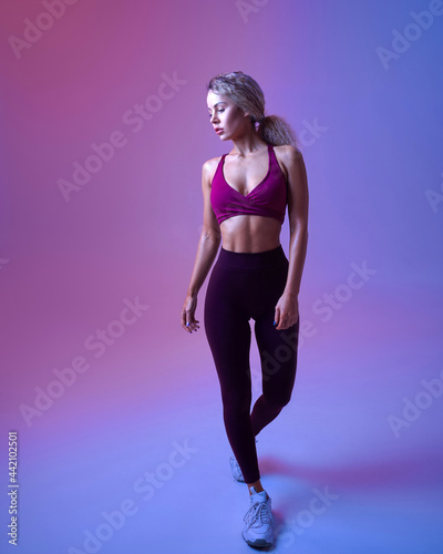 Fototapeta Naklejka Na Ścianę i Meble -  Young athletic woman, neon background