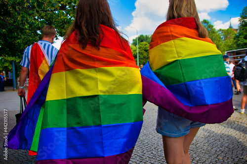 Canvas Print Two women carry a rainbow flag on Christopher Street Day (CSD)