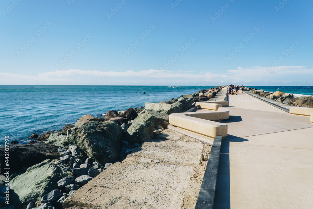 Wide shot of the seaway promenade towards the harbour mouth at the spit near Surfers Paradise
