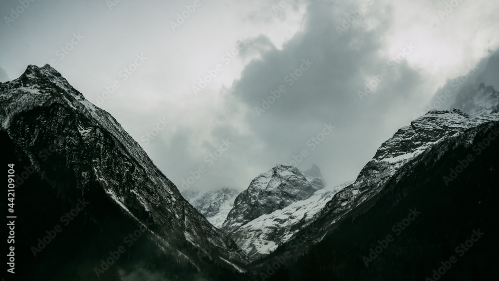 Dramatic snowy mountains Dombay Caucasus mountains banner