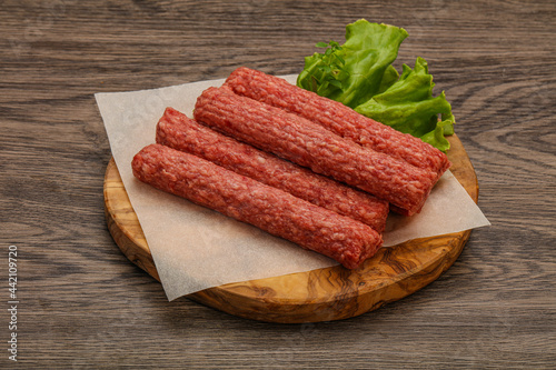 Raw beef sausages with spices