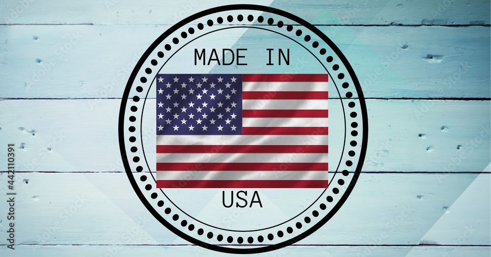 Fototapeta premium Composition of text made in usa and american flag, in circle on white wood planks