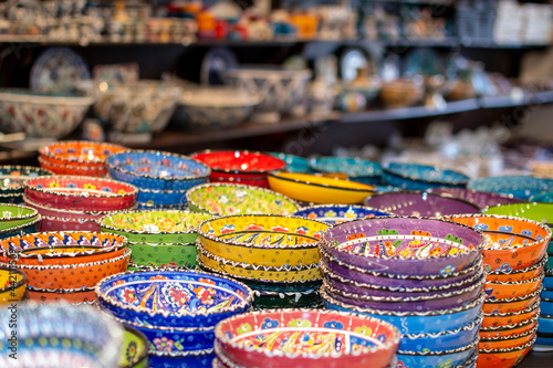 Handmade colorful Turkish traditional ceramic plates at market counter