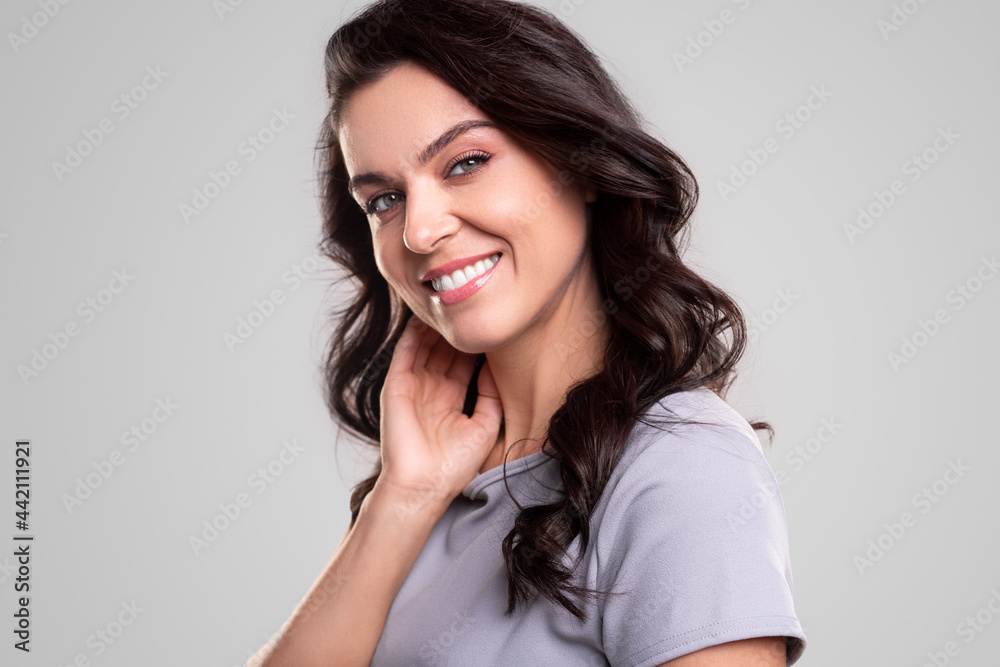 Smiling woman with makeup looking at camera Smiling woman with makeup looking at camera