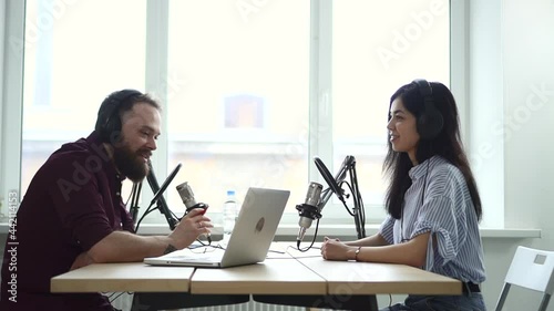 Man interviewing woman influencer, recoding audio on mic for live radio show Spbd. Announcer photo