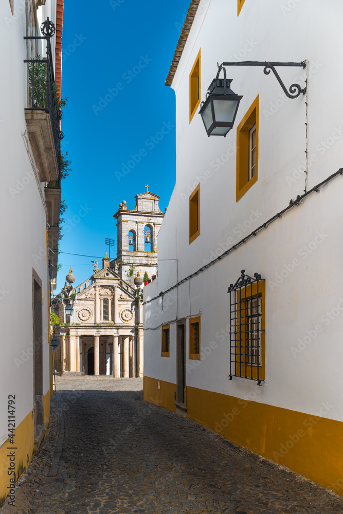 View from the narrow street to the Facade of the Igreja da Graca church of Evora. Alentejo Portugal.