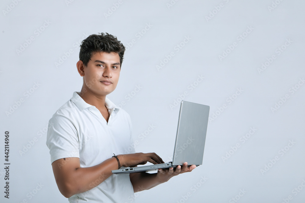 young indian man using laptop. young indian man using laptop.