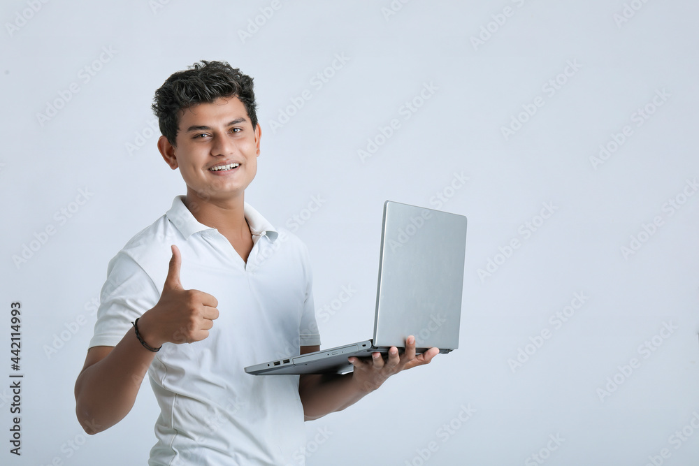 young indian man using laptop. young indian man using laptop.