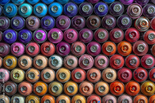 a lot of empty cylinders of paint for graffiti. Tools for street art