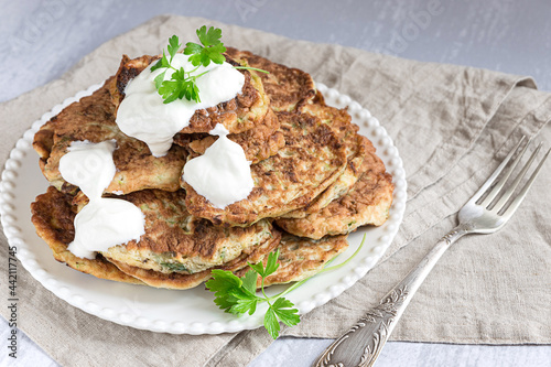 Zucchini fritters or pancakes with yogurt dressing
