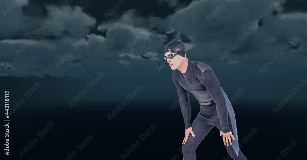 Composition of male swimmer jumping into water on black background Composition of male swimmer jumping into water on black background