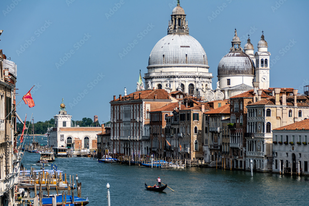 View of the Grand Canal with close up of Santa Maria della Salute, famous Roman Catholic cathedral, seen from Ponte Dell'Accademia