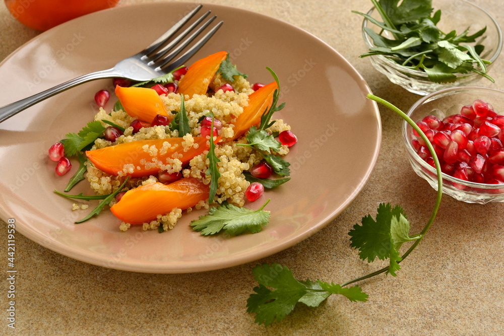 Quinoa salad with persimmon, pomegranate and fresh herbs