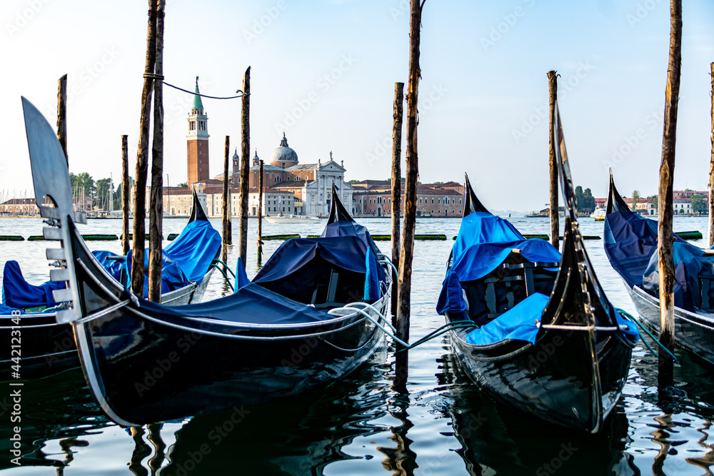 Gondolas mored in front of St. Mark's Square with San Giorgio di Maggiore church in the background Venice, Italy